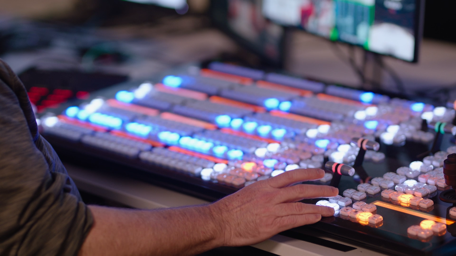 Detail of a broadcast professional managing live transmission of NHL event.