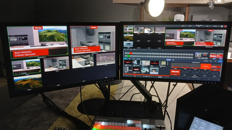 The TriCaster control surface anchors a dual-monitor production desk — the operational backbone of a seamless live broadcast workflow.